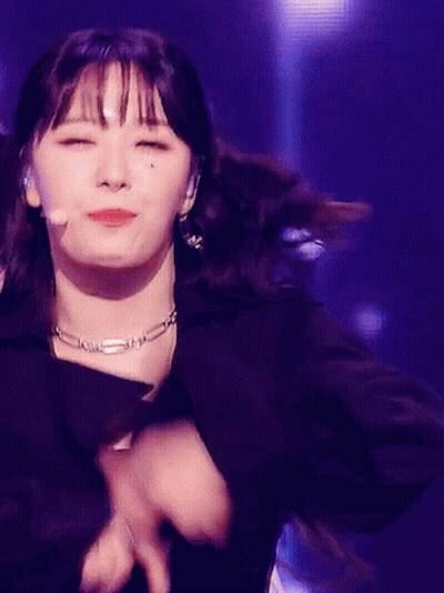 Woman In Black Jacket And Necklace Dancing With Eyes Closed GIF
