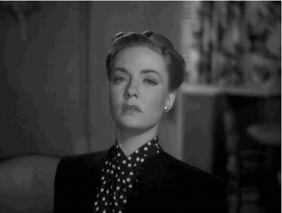 Woman In Black Jacket And Polka Dot Shirt GIF