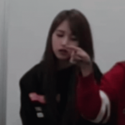 Woman In Black Jacket And Red Sweater Beside Man In Red Jacket GIF