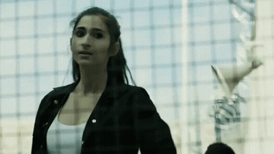 Woman In Black Jacket And White Tank Top GIF