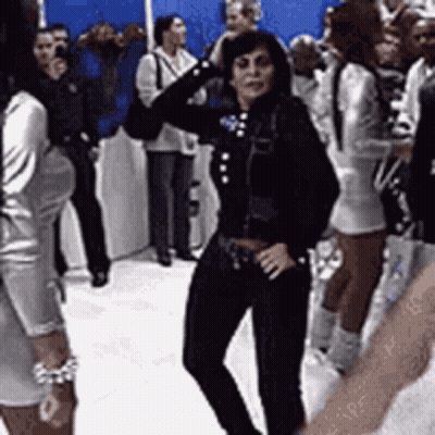 Woman In Black Jacket Dancing In Crowd GIF