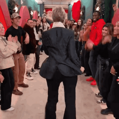 Woman In Black Jacket Dancing In Front Of Crowd GIF