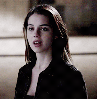 Woman In Black Jacket Looking At Camera GIF