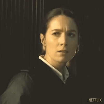 Woman In Black Jacket Looking At Camera GIF