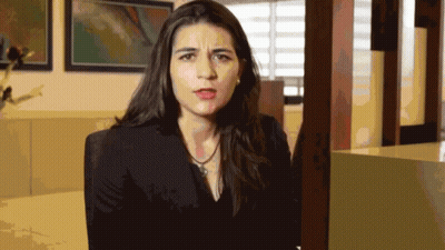 Woman In Black Jacket Making Face GIF