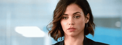 Woman In Black Jacket Making Serious Face GIF