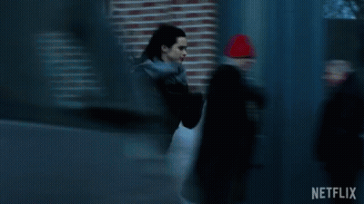 Woman In Black Jacket Running Past Blue Door Netflix GIF