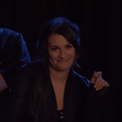 Woman In Black Jacket Smiling And Clapping GIF