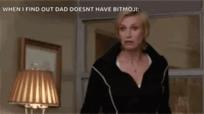 Woman In Black Jacket Standing In Front Of Lamp GIF