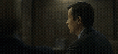Woman In Black Jacket Talking To Man In Blue Shirt GIF