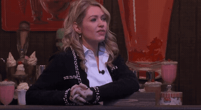 Woman In Black Jacket With Pearls And White Shirt GIF