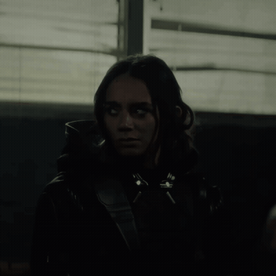Woman In Black Jacket With White Eyes GIF