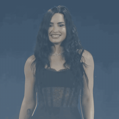 Woman In Black Lace Top Smiling GIF