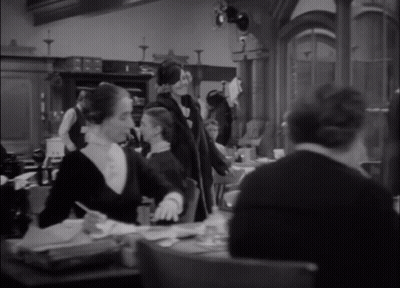 Woman In Black Leather Jacket And Gloves GIF