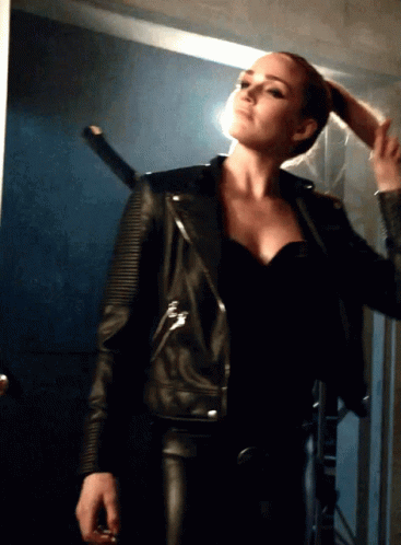 Woman In Black Leather Jacket Holding Hair GIF