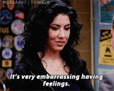 Woman In Black Leather Jacket Standing At Desk GIF