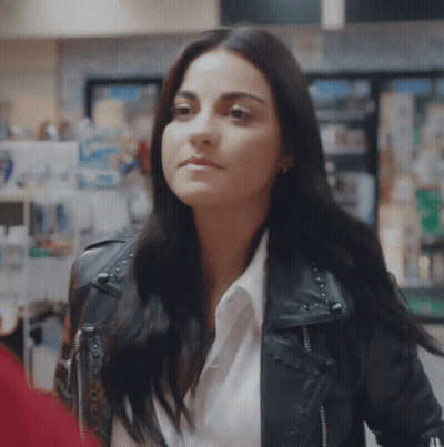 Woman In Black Leather Jacket Standing In Store GIF