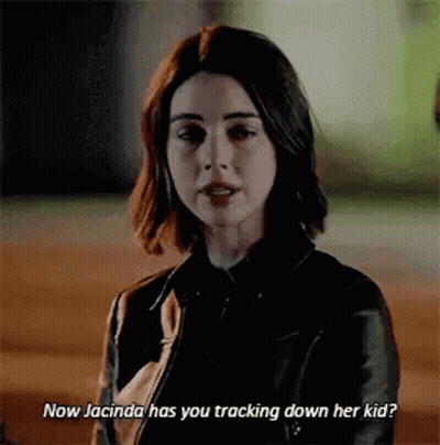 Woman In Black Leather Jacket Talking To Man GIF