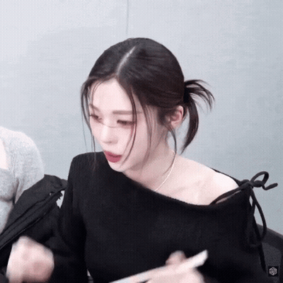 Woman In Black Off Shoulder Holding Paper GIF