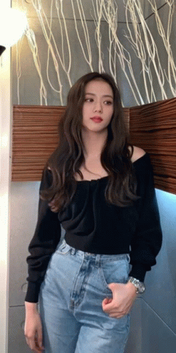 Woman In Black Off-Shoulder Sweater And Blue Jeans GIF