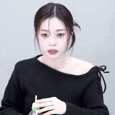 Woman In Black Off The Shoulder Sweater Drinking GIF
