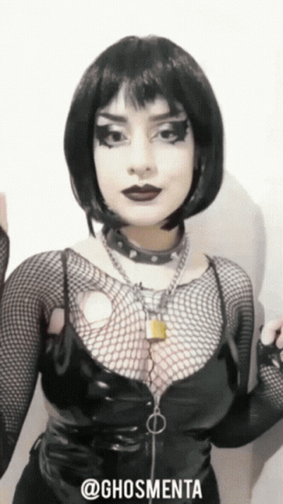 Woman In Black Outfit With Hashtag @Ghosmenta GIF