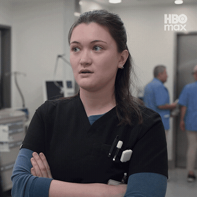 Woman in Black Scrub Arms Crossed HBO Max Logo