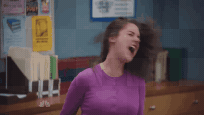 Woman In Black Shirt And Grey Cardigan GIF