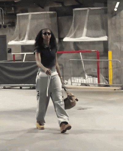 Woman In Black Shirt And Grey Sweatpants With Number 3 GIF