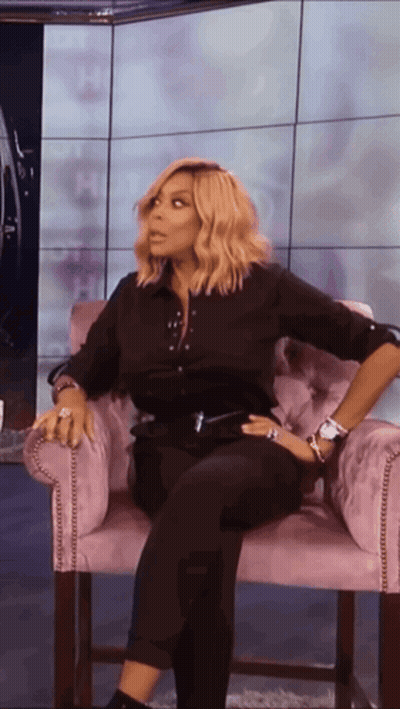 Woman In Black Shirt And Pants Sitting GIF