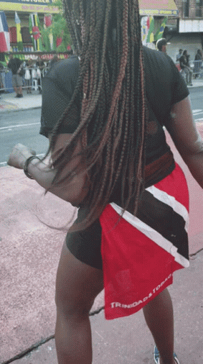 Woman In Black Shirt And Red Shorts Saying Trinidad And Tobago GIF