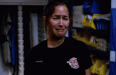 Woman In Black Shirt Fire Department Logo GIF