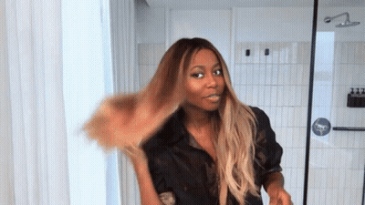 Woman In Black Shirt Hair Blowing In Wind GIF