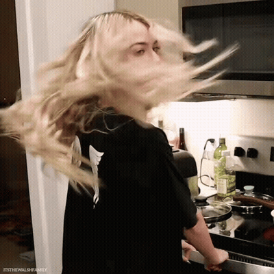 Woman In Black Shirt Hair Blowing GIF