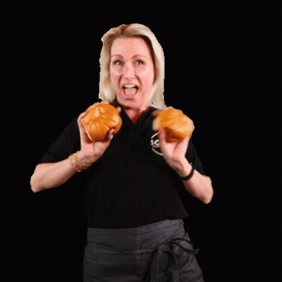 Woman In Black Shirt Holding Two Hamburger Buns GIF
