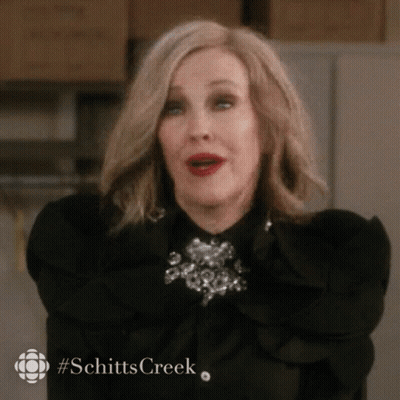 Woman In Black Shirt Making Face GIF