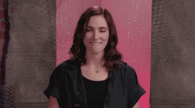 Woman In Black Shirt Making Face GIF