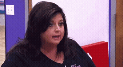 Woman In Black Shirt Making Funny Face GIF