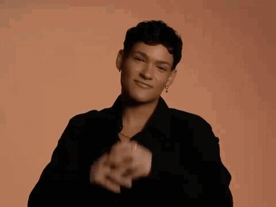 Woman In Black Shirt Making Heart With Hands GIF