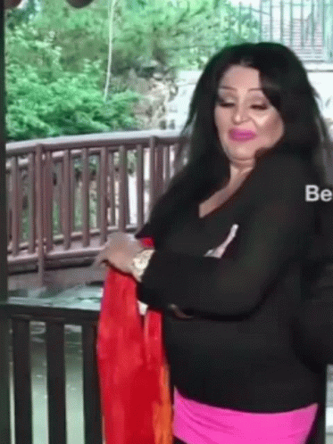 Woman In Black Shirt, Pink Skirt Wooden Railing GIF