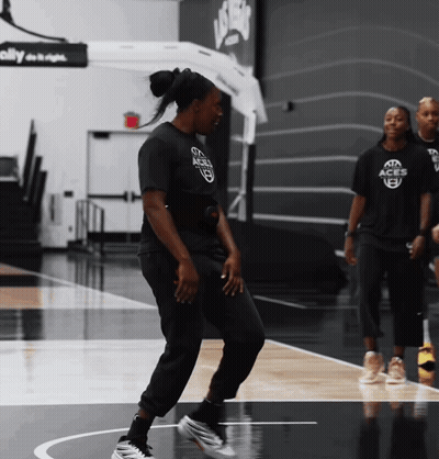 Woman In Black Shirt Saying Aggies Dancing On Court GIF