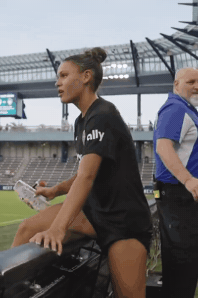 Woman In Black Shirt Saying Ally In Stadium GIF