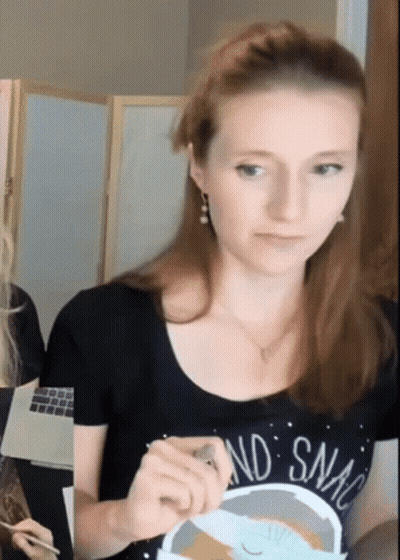 Woman In Black Shirt Saying And Snack GIF