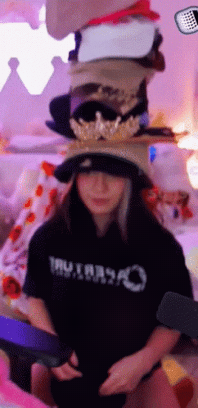 Woman In Black Shirt Saying Tru Stacking Hats GIF