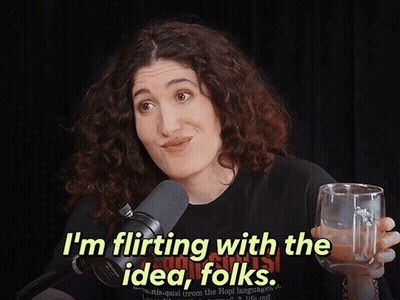 Woman In Black Shirt Says I'm Flirting With The Idea Folks GIF