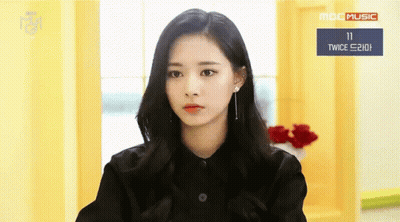 Woman In Black Shirt Sitting By MBC Music Sign GIF