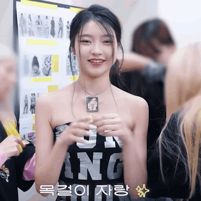 Woman In Black Shirt With J And N GIF