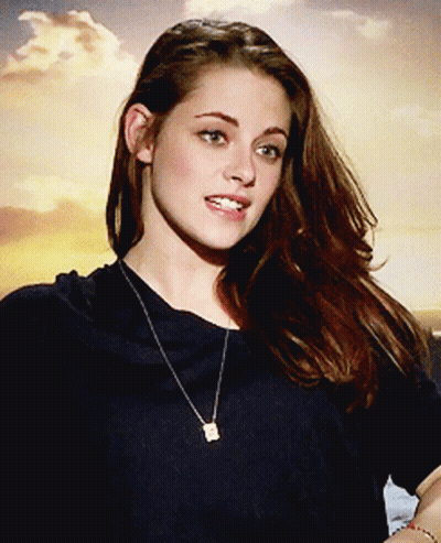 Woman In Black Shirt With Square Pendant Necklace GIF