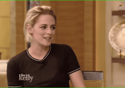 Woman In Black Shirt With Square Pendant Necklace GIF