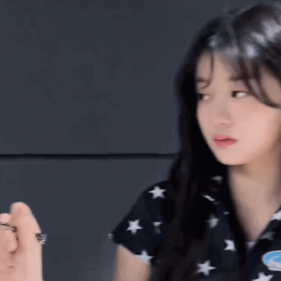 Woman In Black Shirt With Stars GIF
